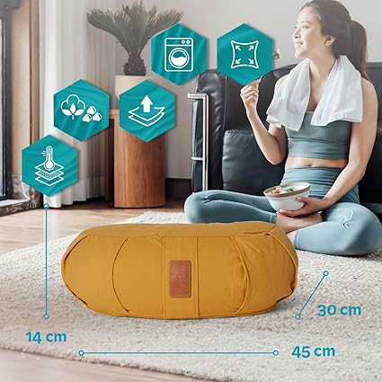 Ergonomic grey crescent meditation cushion designed for pelvic tilt and leg comfort during meditation.